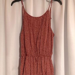 red creamed dotted romper. short legged with spaghetti straps